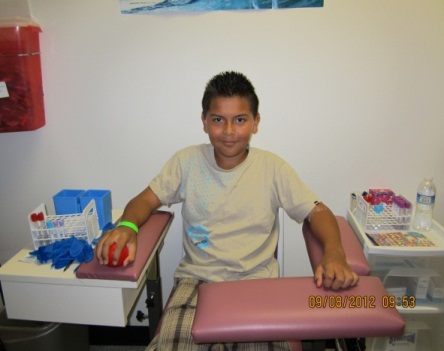 SOL Youth participant preparing to donate blood sample